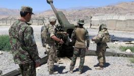 U.S. military advisers from the 1st Security Force Assistance Brigade work with Afghan soldiers at an artillery position on an Afghan National Army base in Maidan Wardak province, Afghanistan on August 6, 2018.
