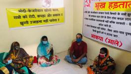Residents of Delhi's Wazirpur slum sitting on hunger strike against the Supreme Court.
