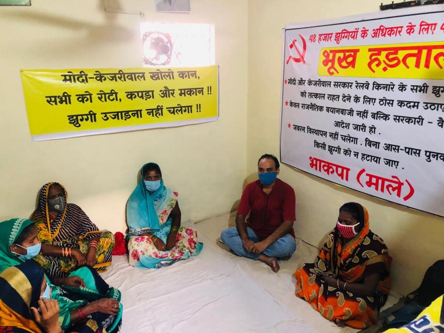 Residents of Delhi's Wazirpur slum sitting on hunger strike against the Supreme Court.