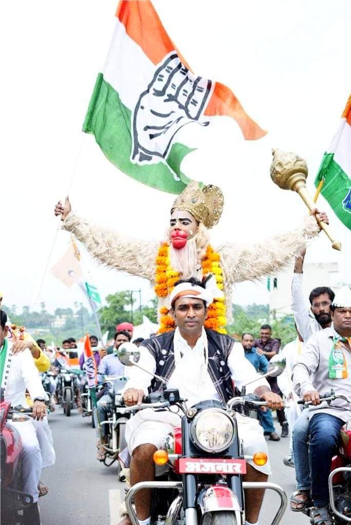 - A man driving a bike with Hanuman's copycat at his back is Congress' youth Congress president and tribal leader Vikrant Bhuria.