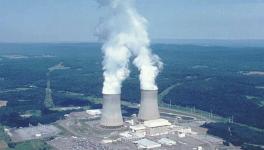 The Susquehanna Steam Electric Station, a boiling water reactor. The reactors are located inside the rectangular containment buildings towards the front of the cooling towers. The power station produces 63 million units of electricity per day.