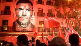 Spanish Socialist Workers' Party supporters celebrate the party's win.