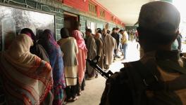 Voters waiting for their turn to cast their vote at Handwara.