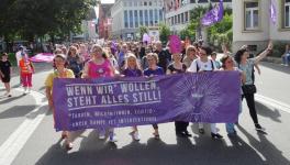 Sea of Purple: With Prams and Whistles, Swiss Women Strike for Equal Pay