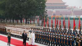 Red carpet welcome: Crown Prince of Abu Dhabi, Sheikh Mohamed bin Zayed, accompanied by Chinese President Xi Jinping, reviews an honour guard at the Great Hall of the People, Beijing, July 22, 2019