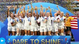 The US Women's National Football Team celebrate at the podium of the FIFA Women's World Cup