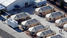 Immigrant children now housed in a tent encampment under the new "zero tolerance" policy by the Trump administration are shown walking in single file at the facility near the Mexican border in Tornillo, Texas, U.S. June 19, 2018.
