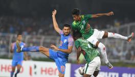 Manvir Singh of Indian football team vie for the ball with Bangladesh players in their FIFA World Cup qualifier match