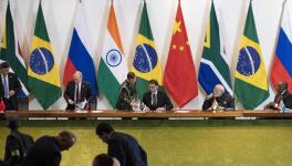 China's President Xi Jinping, left, Russia's President Vladimir Putin, second from left, Brazil's President Jair Bolsonaro, center, India's Prime Minister Narendra Modi, second from right, and South Africa's President Cyril Ramaphosa leave after a meeting during the BRICS emerging economies, Brasilia, Brazil