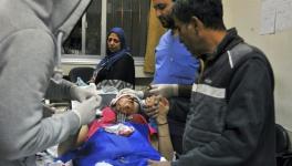 Paramedics at a hospital in Damascus treat the wounded after the Israeli missile strikes on Tuesday, November 20. 