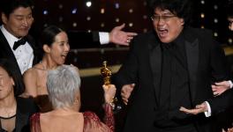 Oscars 2020: Parasite director Bong Joon Ho (right) receiving the Best Picture award