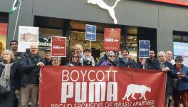 Protestors outside a Puma flagship store in London demanding the company end its sponsorship deal with the Israel Football Association (IFA). (@PACBI/ Twitter)