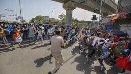 Migrant workers and police clash in Ahmedabad