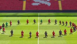Liverpool players take the knee during training for George Floyd