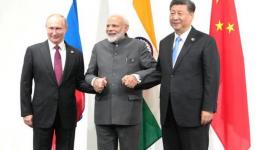 Vladimir Putin (L), Narendra Modi (C) and Xi Jinping (R) met at an informal trilateral meeting on the sidelines of the G20, Osaka, June 18, 2019