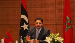 Morocco’s foreign minister chairing the meeting of delegates of rival governments in Libya on Sunday, September 6
