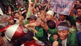 Braving repression, thousands take to the streets in Indonesia against Omnibus Law