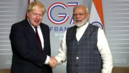 Prime Minister Modi (R) and UK PM Boris Johnson. File photo