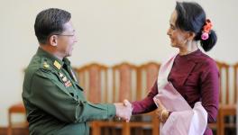 n this file photo dated Dec. 2, 2015 Myanmar military chief General Min Aung Hlaing (L) and National League for Democracy party leader Aung San Suu Kyi (R) shake hands after their meeting at the Commander-in-Chief's office in Naypyidaw.