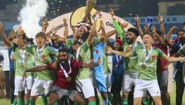 Gokulam Kerala FC players with the I-league trophy