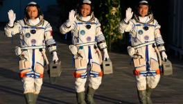 Chinese astronauts, from left, Tang Hongbo, Nie Haisheng, and Liu Boming