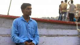 Rakesh Sahani/ Chulshu(his Korean name) from Varanasi sitting at the Dashashwamedh Ghat, Varanasi
