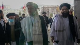 Taliban government’s deputy prime minister Abdul Salam Hanafi (C) and Acting Foreign Minister Amir Khan Muttaqi (R) arrive in Moscow to attend international talks on Afghanistan, Oct. 20, 2021