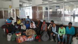 Non local laborers waiting for train inside railwaysation Nowgam. Photo by Kamran Yousuf