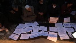 Candle light protest by two families at press enclave Srinagar 