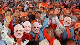 Varanasi, Mar 05 (ANI): Bharatiya Janata Party (BJP) supporters wearing cutouts of Prime Minister Narendra Modi attend a public rally by PM Narendra Modi for the seventh and last phase of Uttar Pradesh Assembly elections, at Khajuri Village, Rajatalab, in Varanasi on Saturday.