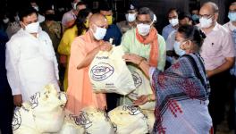 Uttar Pradesh CM Yogi Adityanath distributes ration to people