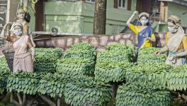 A portrayal of tea workers outside the Valparai Municipality office.