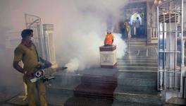 rihanmumbai Municipal Corporation (BMC) Worker sanitizes a premise of a temple as the cases of dengue and malaria rises, in Mumbai