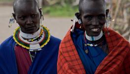 Maasai women in traditional clothing and jewellery in the Serengeti National Park, Tanzania