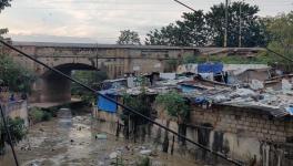 The railway tracks at Pulakeshinagar (pictured behind the slum)