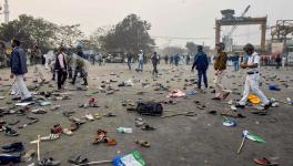  Footwears lie on a road after clashes between ISF members and the police following their rally, in Kolkata, Saturday, Jan. 21, 2023.