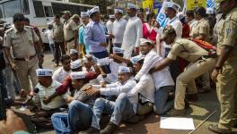 Police personnel detain Aam Aadmi Party (AAP) workers during a protest against the arrest of Delhi Deputy Chief Minister Manish Sisodia by CBI in the excise policy case, in Bhubaneswar, Monday, Feb. 27, 2023.