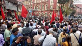 West Bengal government employees during a protest march demanding to clear their pending Dearness Allowance (DA), in Kolkata, Friday, Feb. 17, 2023. Image Courtest: PTI