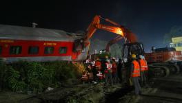 Rescue team members during a search operation after the accident involving three trains that claimed at least 261 people and left over 900 injured, in Balasore district, Odisha, Saturday, June 3, 2023. 