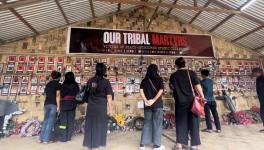 Visitors at the ‘Wall of Remembrance’ set up in the memory of people of the Kuki-Zo community who lost lives in the violence.