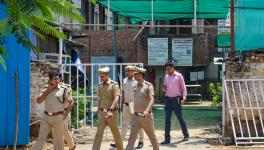 Police personnel outside Anjuman Mosque which was set ablaze in the Sector 57 area, in Gurugram district, Tuesday, Aug. 1, 2023.