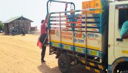 People climbing on the trucks for the road journey (Photo - Prasanth Muthuraman, 101Reporters).