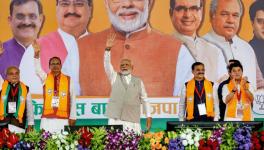 Prime Minister Narendra Modi waves at supporters during BJP's 'Karyakarta Mahakumbh', in Bhopal, Monday, Sept. 25, 2023