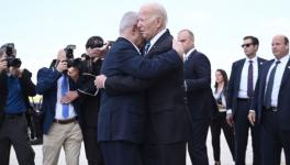 US President Joe Biden hugs Israeli PM Benjamin Netanyahu upon arrival at Tel Aviv airport, October 18, 2023