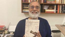 Prabir Purkayastha holding his recent book, Knowledge as Commons. Pic: Counterpunch