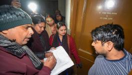 Enumerators receive information from a Patna resident during a caste-based survey in Bihar.