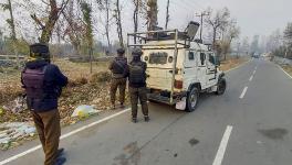 Security personnel stand guard during an encounter with militants, in Kulgam, Thursday, Nov. 16, 2023.