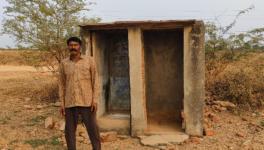 Mangi Lal, a Dalit resident of Mandsaur’s Panch Khaira village, outside the toilet constructed around six years ago. The toilet has no septic tank.