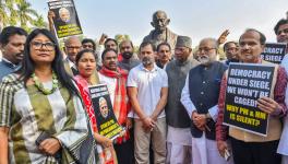Congress MPs Mallikarjun Kharge and Rahul Gandhi with suspended Opposition MPs during a protest at Mahatma Gandhi statue during the Winter session of Parliament, in New Delhi, Tuesday, Dec. 19, 2023.