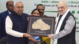 Union Home Minister Amit Shah being presented a memento by Bihar Chief Minister Nitish Kumar during the 26th meeting of Eastern Zonal Council, in Patna, Sunday, Dec. 10, 2023. 